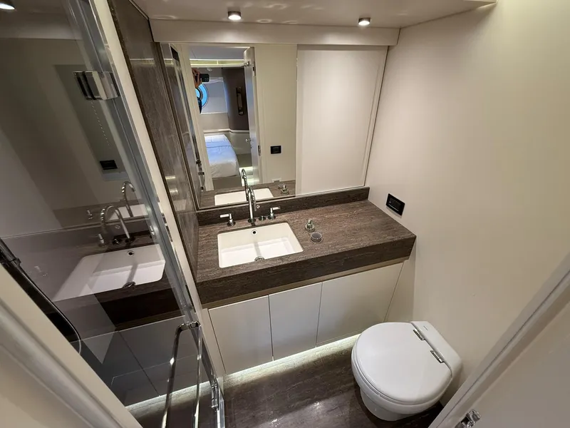 Slide: The Image of Luxurious cabin interior of 2026 Azimut Magellano 25M yacht with porthole window. - 8