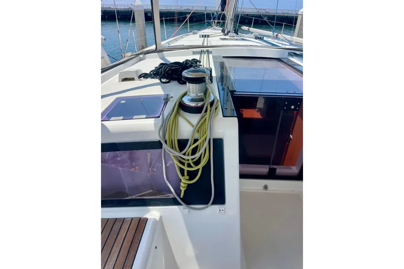 Slide: The Image of 2018 Beneteau Oceanis 48 yacht deck with ropes and winch. - 20