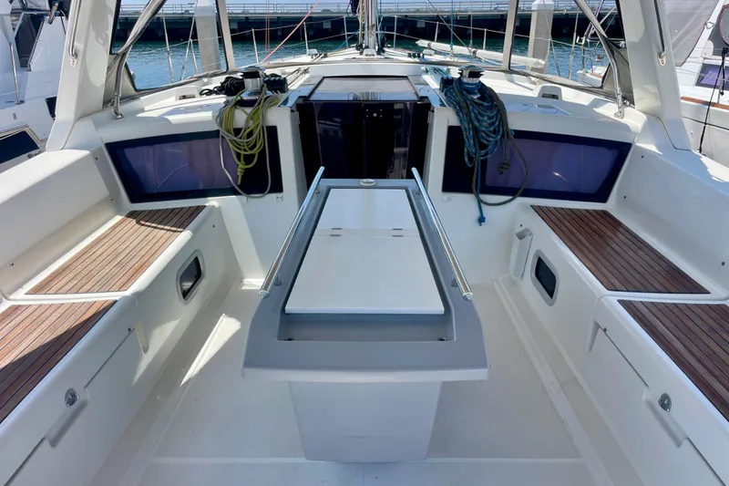 Slide: The Image of Cockpit of 2018 Beneteau Oceanis 48 sailboat with seating and ropes. - 21