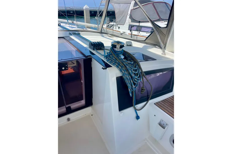 Slide: The Image of 2018 Beneteau Oceanis 48 yacht deck with winch and ropes. - 22