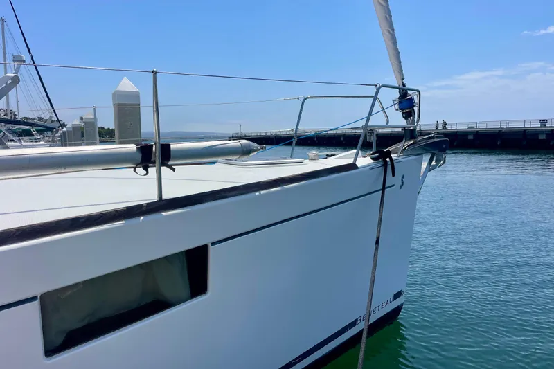 Slide: The Image of 2018 Beneteau Oceanis 48 yacht docked at a marina under clear blue skies. - 28