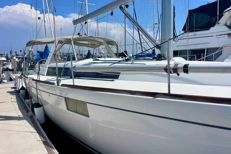 Slide: The Image of 2018 Beneteau Oceanis 48 yacht docked at marina under clear blue sky. - 29