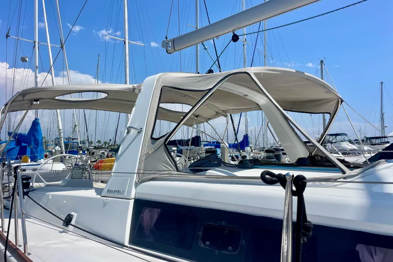 Slide: The Image of 2018 Beneteau Oceanis 48 sailboat docked at marina under clear blue sky. - 32