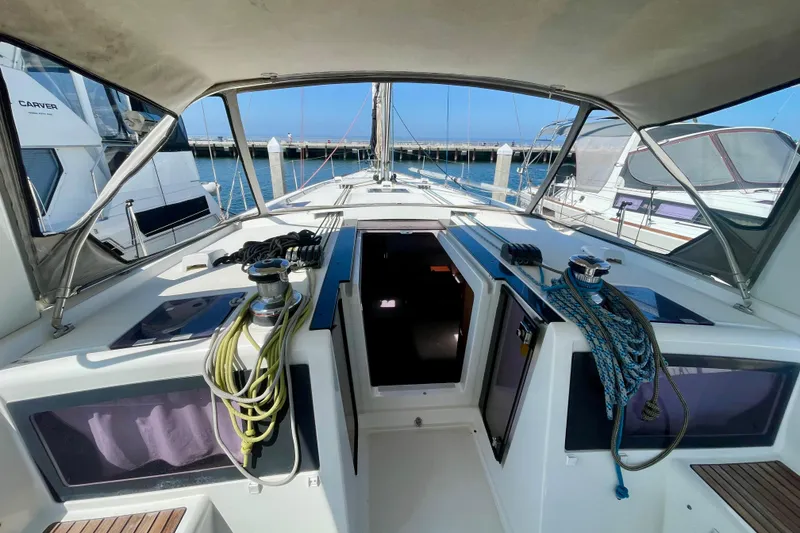 Slide: The Image of 2018 Beneteau Oceanis 48 yacht cockpit with ropes and winches, docked at marina. - 34