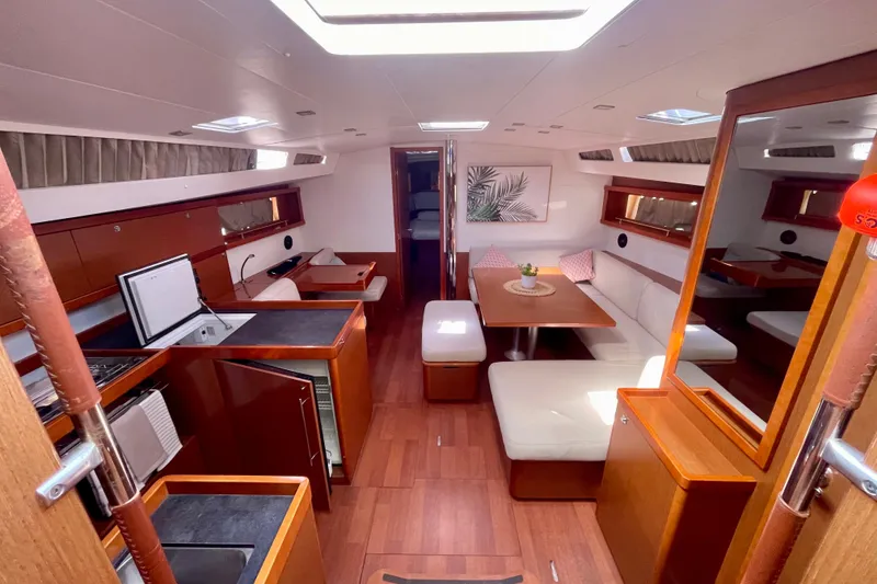 Slide: The Image of Luxurious interior of 2018 Beneteau Oceanis 48 yacht with modern kitchen and seating area. - 35