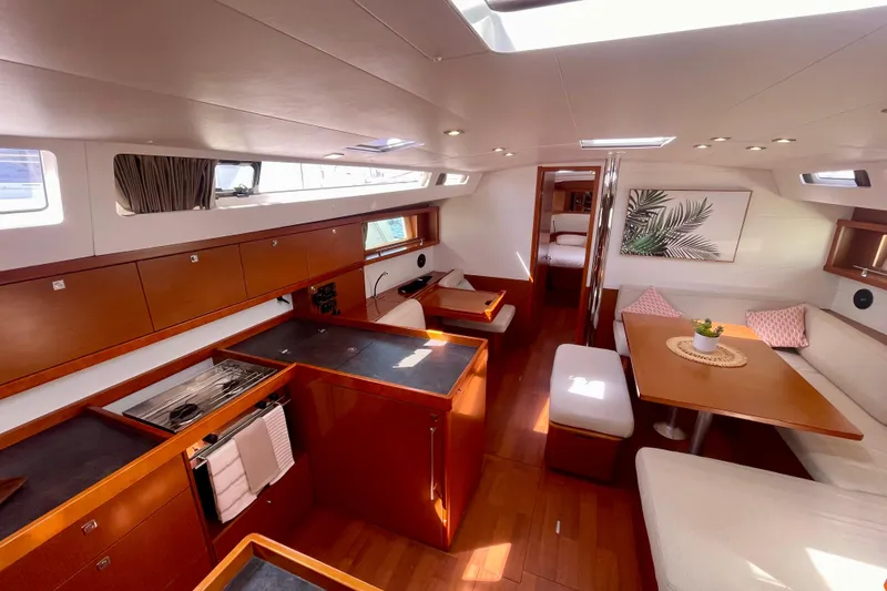 Slide: The Image of Luxurious interior of 2018 Beneteau Oceanis 48 yacht with modern kitchen and dining area. - 39