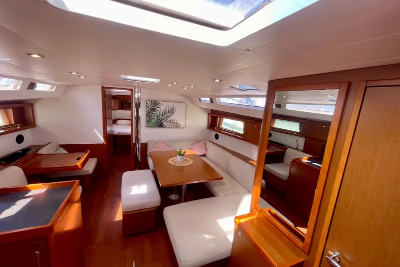 Slide: The Image of Luxurious interior of 2018 Beneteau Oceanis 48 yacht with elegant wood finish and plush seating. - 41