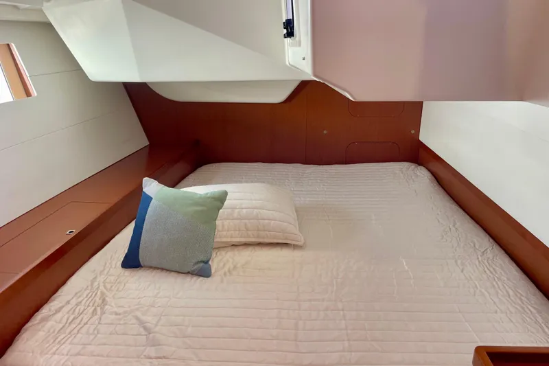 Slide: The Image of Cozy cabin interior of 2018 Beneteau Oceanis 48 yacht with comfortable bedding. - 45
