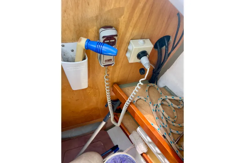 Slide: The Image of Interior of 2018 Beneteau Oceanis 48 showing electrical connections and nautical equipment. - 6