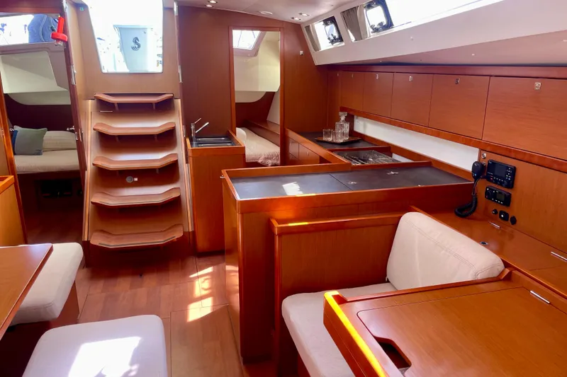 Slide: The Image of Interior of 2018 Beneteau Oceanis 48 yacht, featuring modern wood finish and spacious layout. - 60