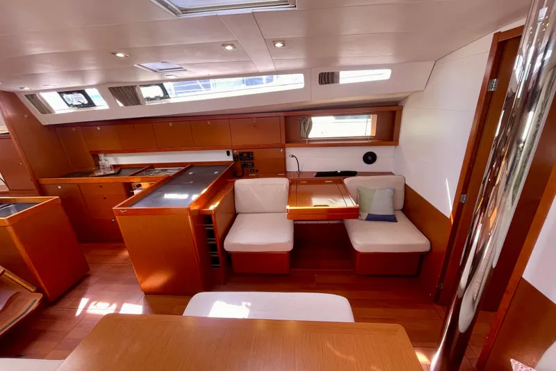 Slide: The Image of Luxurious interior of 2018 Beneteau Oceanis 48 yacht with modern kitchen and seating area. - 63