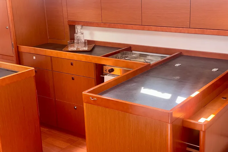 Slide: The Image of Luxurious wooden kitchen interior of 2018 Beneteau Oceanis 48 yacht. - 67