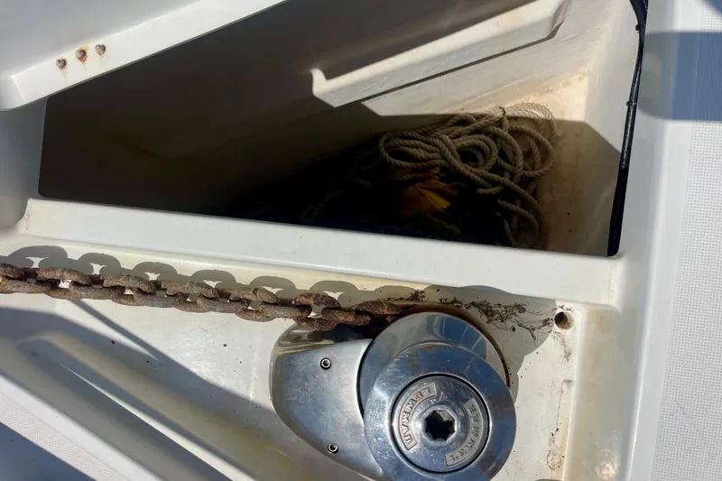 Slide: The Image of Anchor chain and windlass on a 2018 Beneteau Oceanis 48 sailboat. - 7