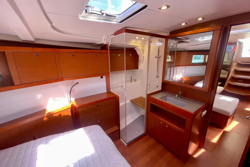 Slide: The Image of Luxurious interior of 2018 Beneteau Oceanis 48 yacht with wood finish and modern amenities. - 76
