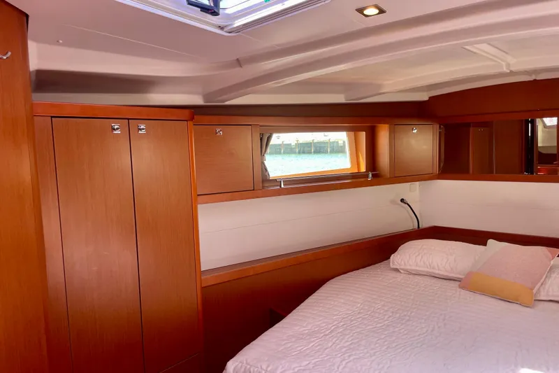 Slide: The Image of Luxurious cabin interior of 2018 Beneteau Oceanis 48 yacht with wood finish. - 78