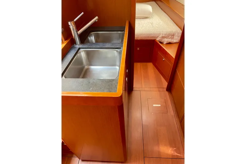 Slide: The Image of Interior of 2018 Beneteau Oceanis 48 yacht with dual sinks and cozy cabin. - 82