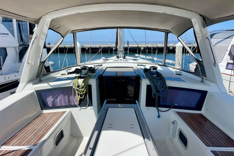 Slide: The Image of Cockpit view of 2018 Beneteau Oceanis 48 sailboat docked at marina. - 83