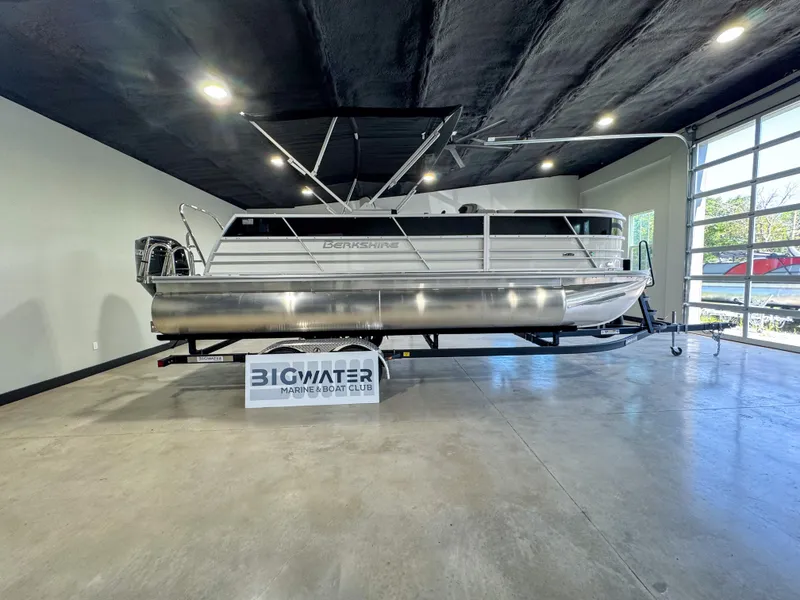 The Image of 2025 Berkshire 22 CL2 LE pontoon boat displayed indoors at Bigwater Marine & Boat Club. - 1