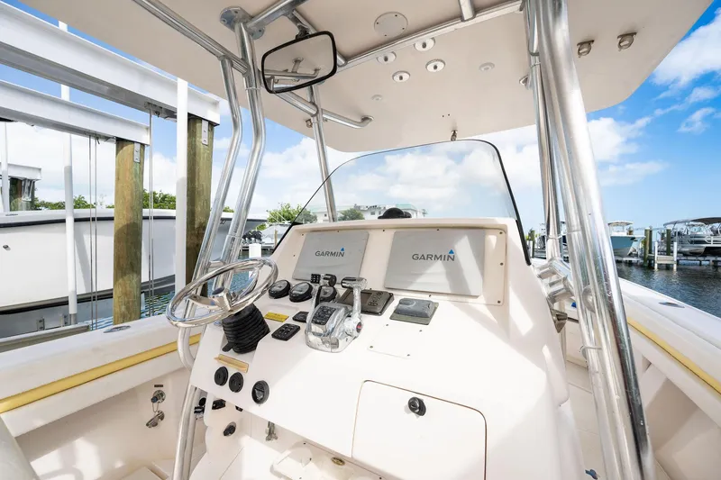Slide: The Image of 2009 Intrepid 323 CC boat dashboard with Garmin navigation system, docked at marina. - 9