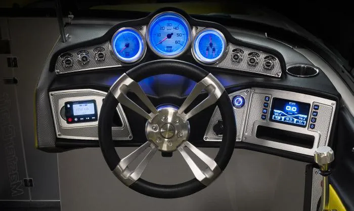 Slide: The Image of Manufacturer Provided Image: 2015 MasterCraft X10 boat dashboard with illuminated gauges and modern controls. - 15