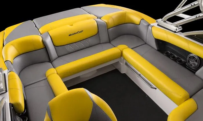Slide: The Image of Manufacturer Provided Image: 2015 MasterCraft X10 boat interior with yellow and gray seating. - 17