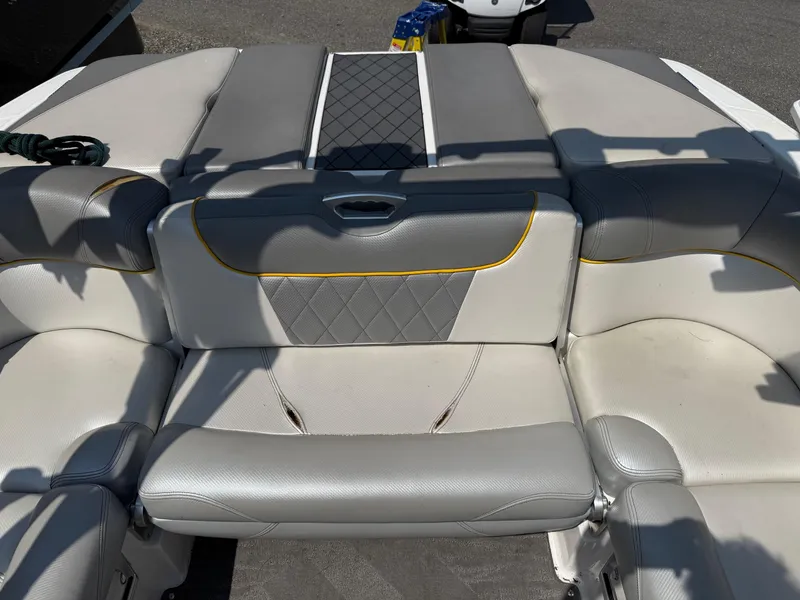 Slide: The Image of 2015 MasterCraft X10 boat interior with gray and white cushioned seating. - 6