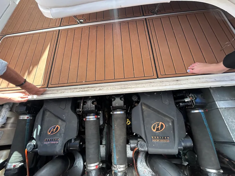 Slide: The Image of Engine compartment of a 2001 Sea Ray 310 Sundancer with Mercury MerCruiser engines. - 13