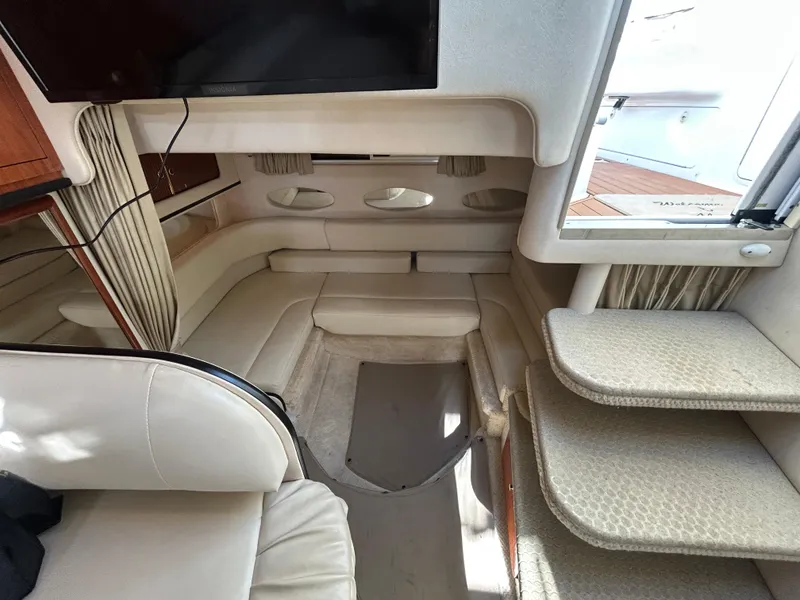 Slide: The Image of Interior of 2001 Sea Ray 310 Sundancer yacht with seating and steps. - 2