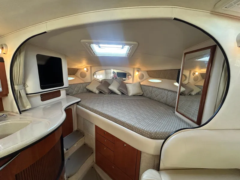 Slide: The Image of Luxurious interior of 2001 Sea Ray 310 Sundancer yacht with cozy bed and modern amenities. - 5