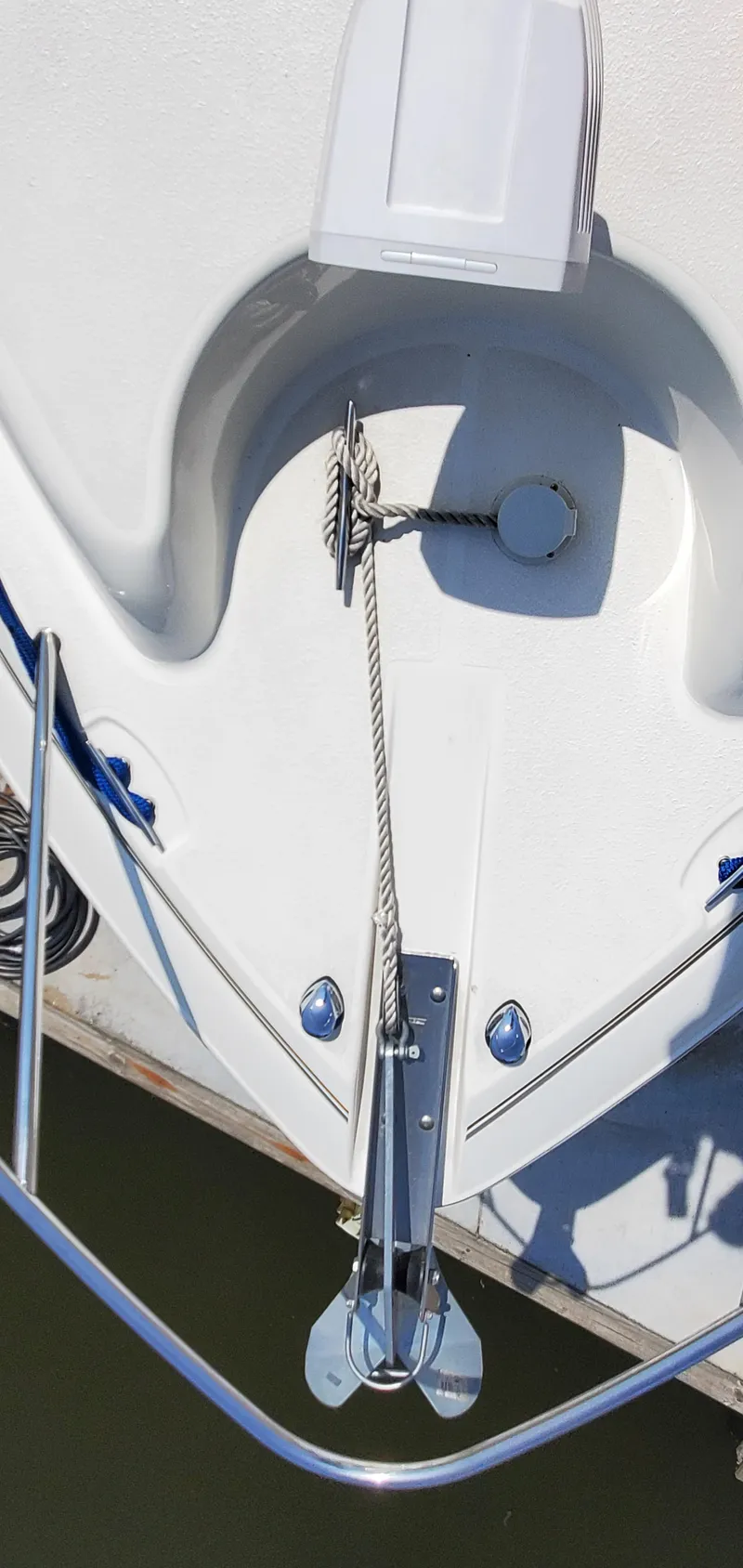 Slide: The Image of 2003 Wellcraft 2400 Martinique boat bow with anchor and rope detail. - 14