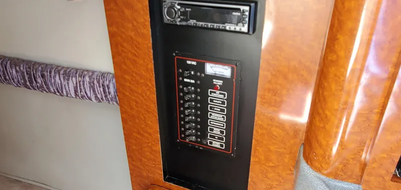 Slide: The Image of Control panel of a 2003 Wellcraft 2400 Martinique boat with wood finish. - 17