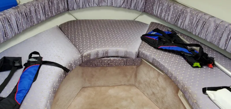 Slide: The Image of Interior cabin of 2003 Wellcraft 2400 Martinique boat with seating and life jackets. - 22