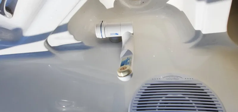 Slide: The Image of Close-up of a 2003 Wellcraft 2400 Martinique boat's interior detail, featuring a speaker and fittings. - 29