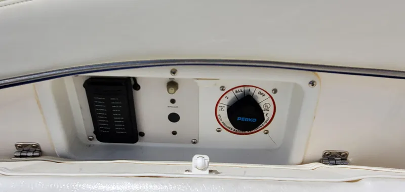 Slide: The Image of Control panel of a 2003 Wellcraft 2400 Martinique boat, featuring a Perko battery switch. - 30