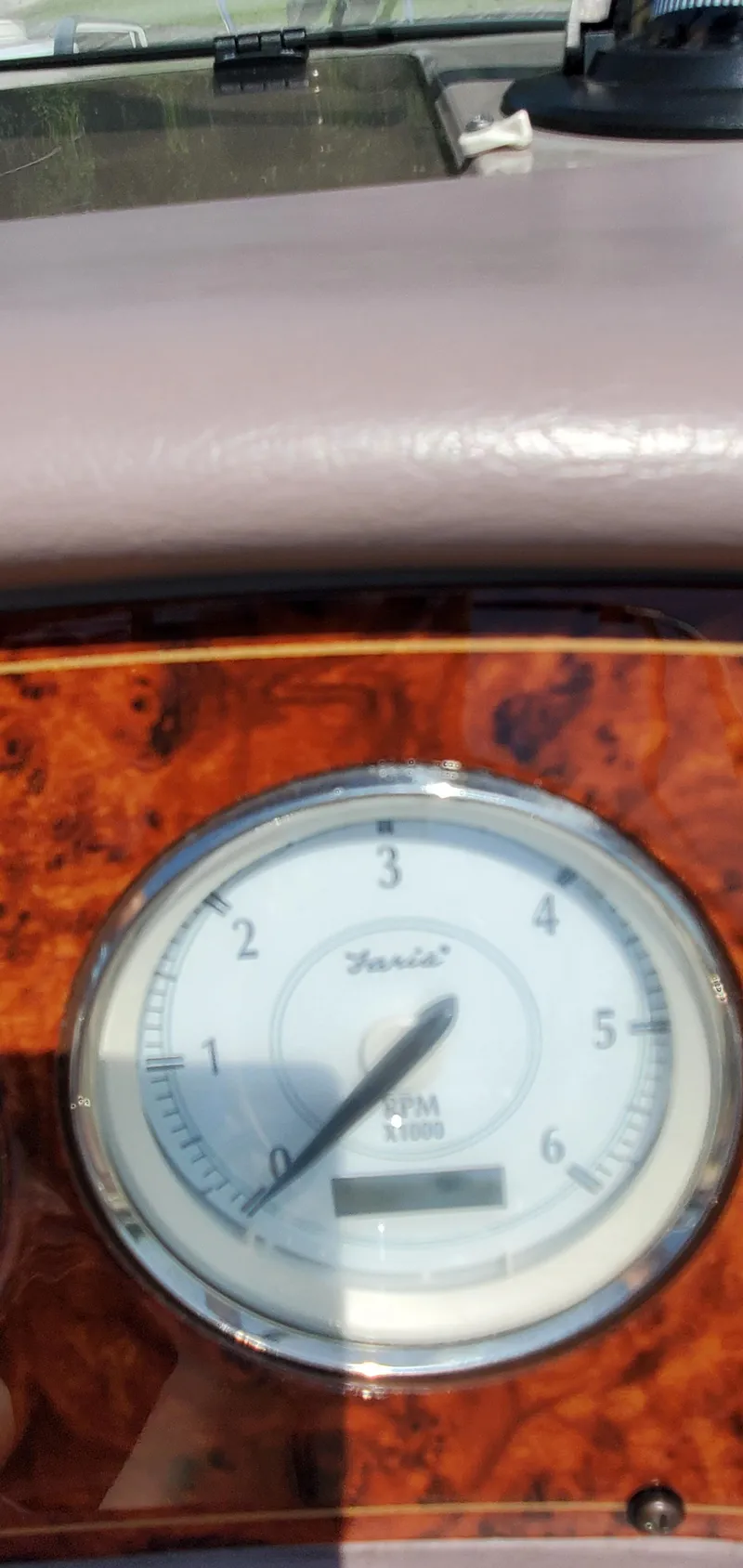Slide: The Image of Close-up of a 2003 Wellcraft 2400 Martinique boat tachometer. - 31