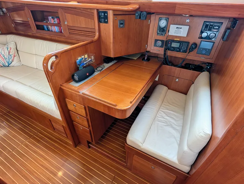 Slide: The Image of Control panel of a 2015 Outbound 46 yacht with navigation and communication equipment. - 11