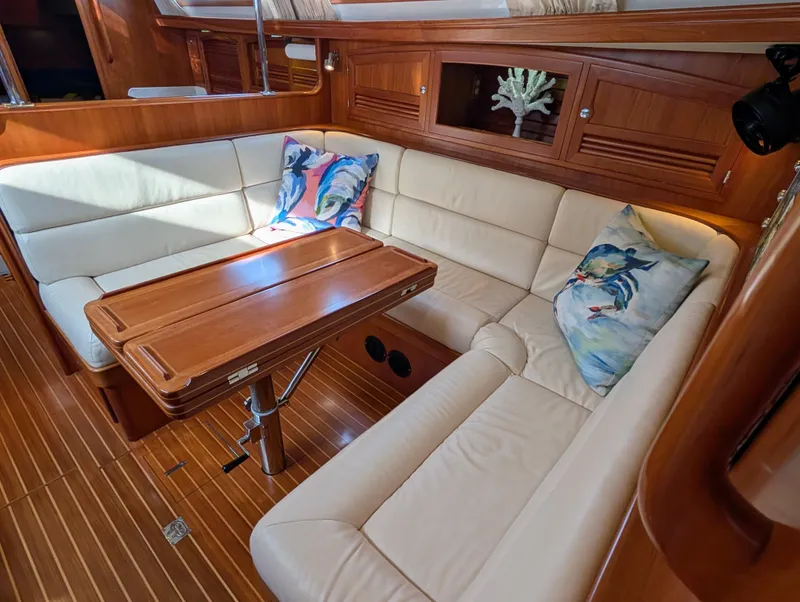 Slide: The Image of Luxurious interior of 2015 Outbound 46 yacht with cream sofa and wooden accents. - 13