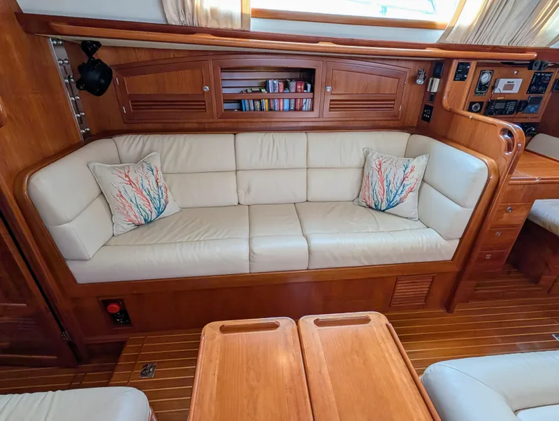 Slide: The Image of Luxurious cabin interior of 2015 Outbound 46 yacht with wood finish and cozy bed. - 14