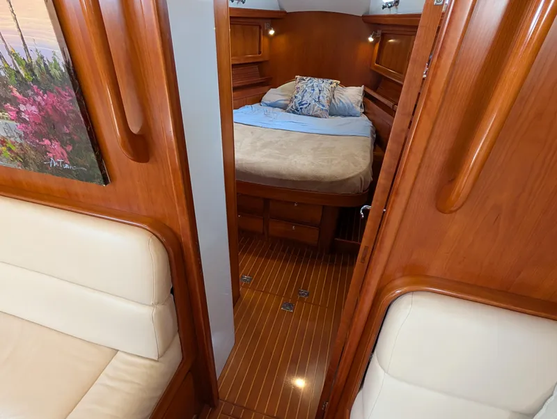Slide: The Image of Luxurious wooden cabin interior of 2015 Outbound 46 yacht with cozy bed and ambient lighting. - 15