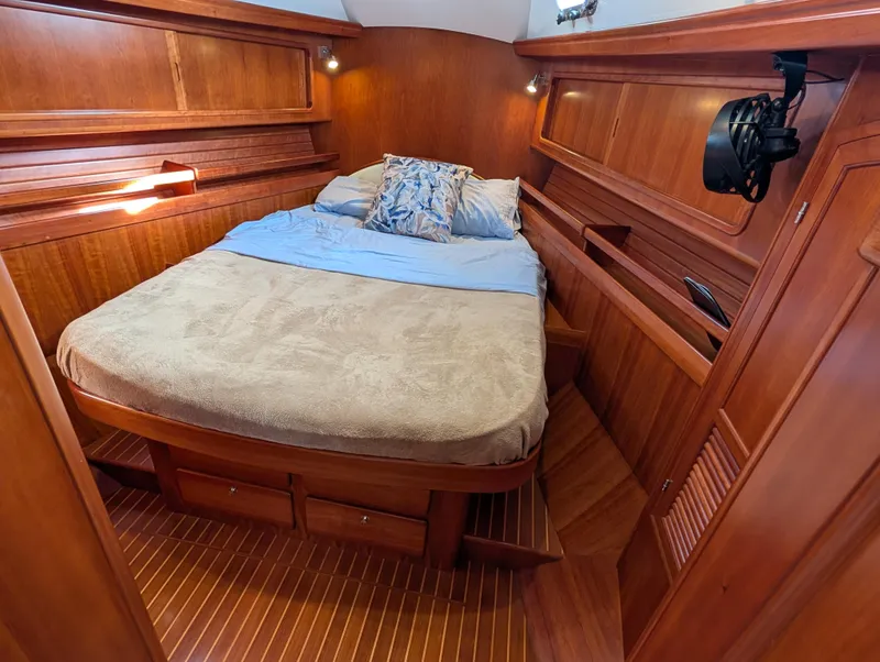 Slide: The Image of Wooden interior of 2015 Outbound 46 yacht cabin with fire extinguisher. - 16