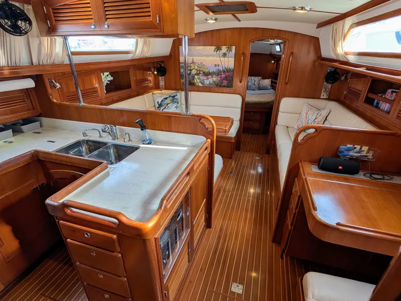 Slide: The Image of Luxurious 2015 Outbound 46 yacht interior with wood finish and modern amenities. - 2