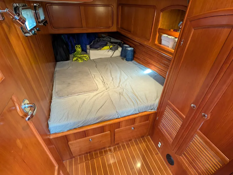 Slide: The Image of Interior of 2015 Outbound 46 yacht showing bathroom and navigation area. - 22