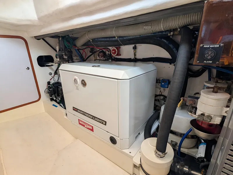 Slide: The Image of Polished wooden interior of 2015 Outbound 46 yacht, featuring sleek flooring and cozy cabin space. - 28