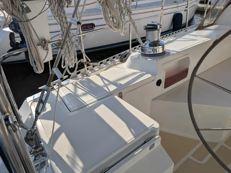 Slide: The Image of Cockpit of 2015 Outbound 46 sailboat with steering wheel and ropes. - 34