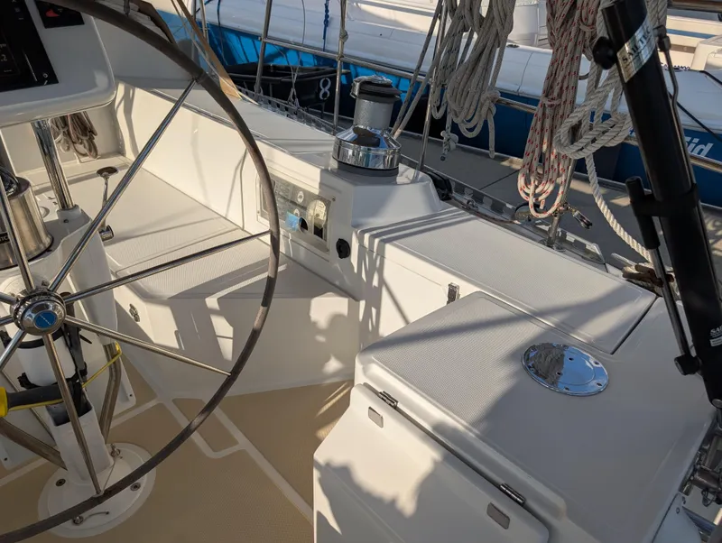 Slide: The Image of Deck of 2015 Outbound 46 sailboat with storage compartment and water view. - 35