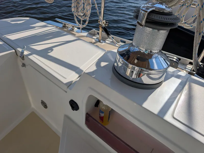 Slide: The Image of Control panel and winch on a 2015 Outbound 46 sailboat deck. - 39