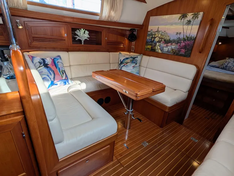 Slide: The Image of Luxurious 2015 Outbound 46 yacht kitchen with wood cabinetry and modern appliances. - 4