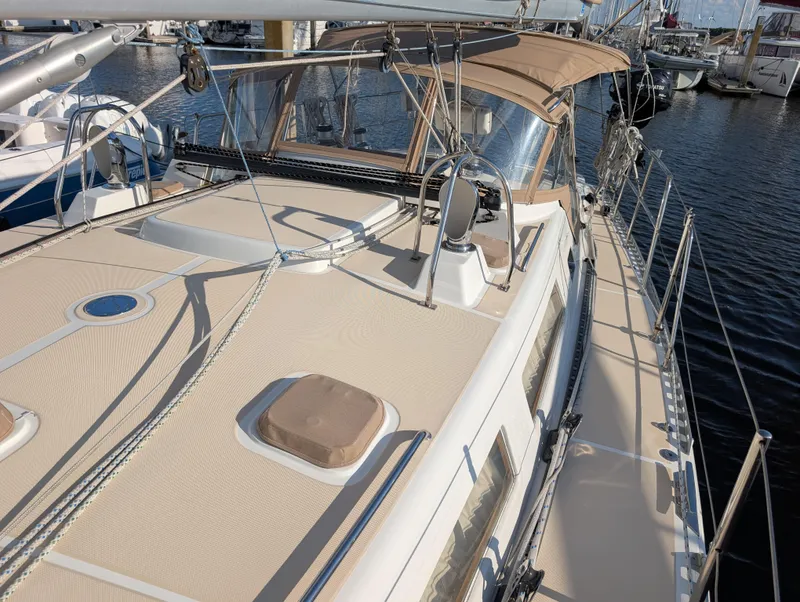 Slide: The Image of Deck of 2015 Outbound 46 sailboat with clean lines and railing. - 45