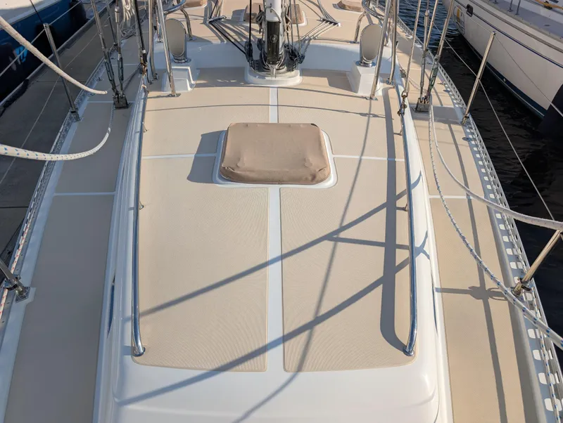 Slide: The Image of Sailing yacht rigging on a 2015 Outbound 46, featuring ropes and winches at the bow. - 46