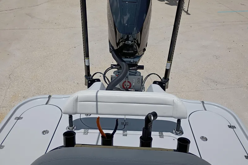 Slide: The Image of 2025 Yellowfin 24 CE boat deck with motor and fishing rod holders. - 10
